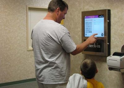 Wall Mounted Kiosk In use for Check In