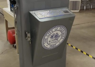 Outdoor self-service kiosk with keyboard in production