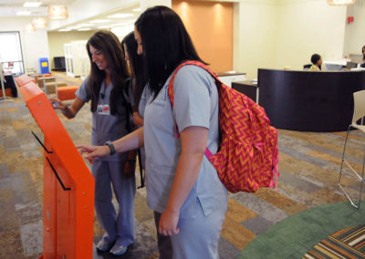 University of Tennessee Students with Freestanding Self Service Kiosks