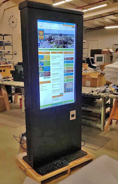 Touch screen indoor kiosk being tested at kiosk factory