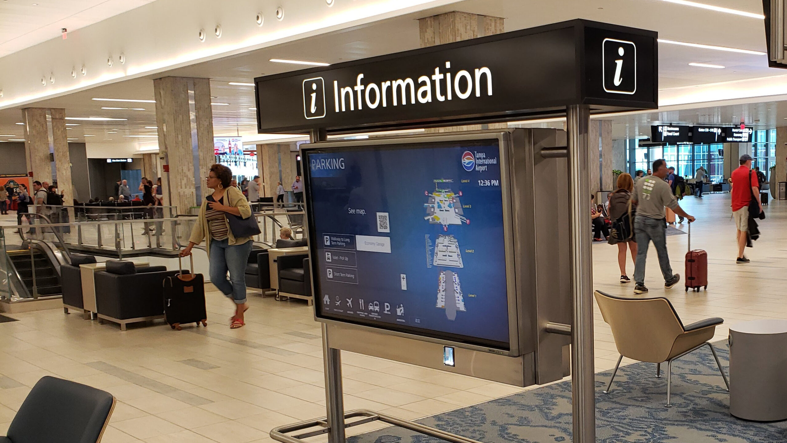 A digital “Information” kiosk at Tampa International Airport