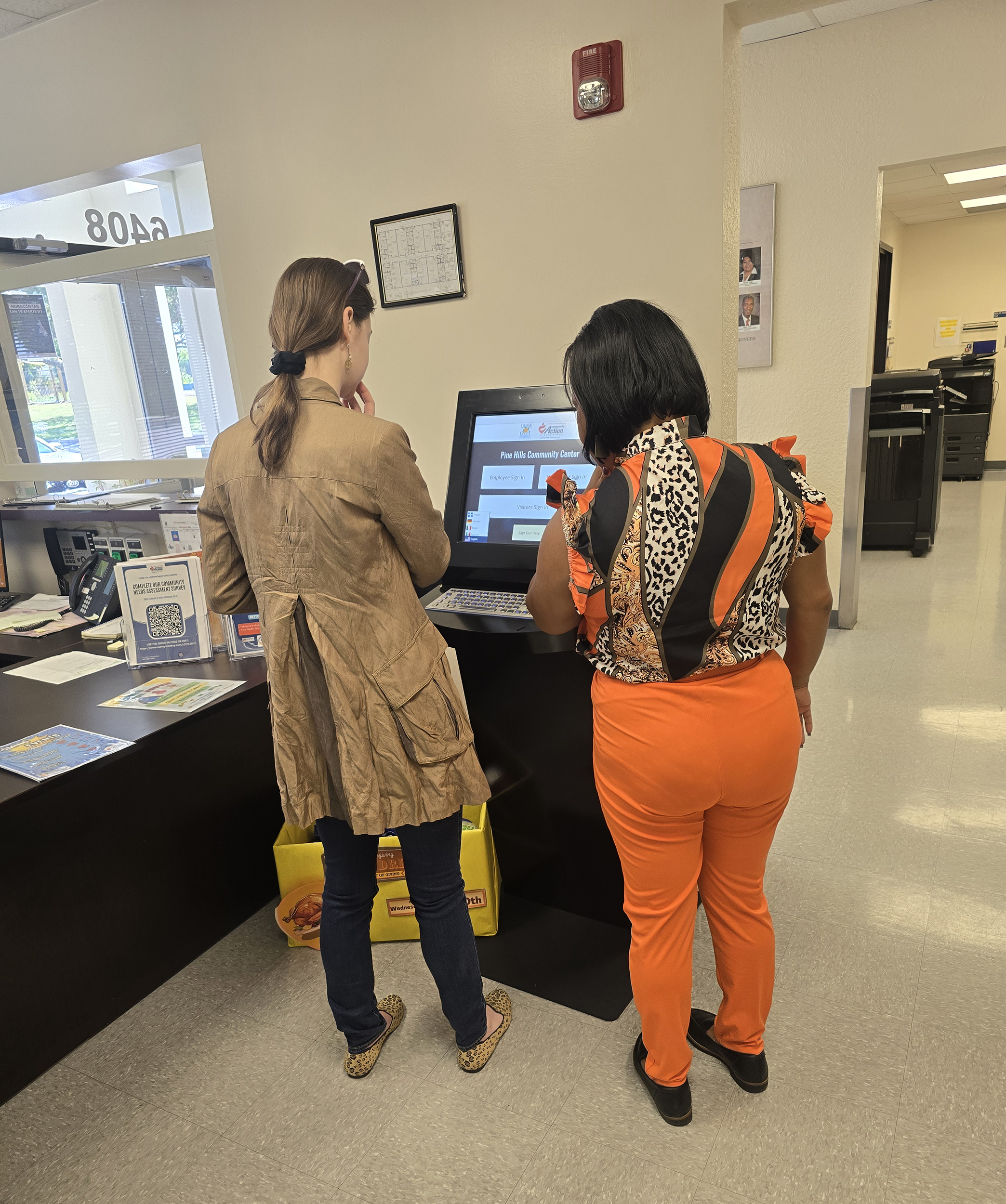 Users interacting with government kiosk