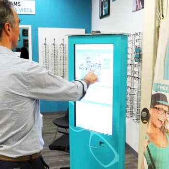 Devlyn Optical virtual eyewear fitting kiosk in use Devlyn Optical virtual eyewear fitting kiosk in use
