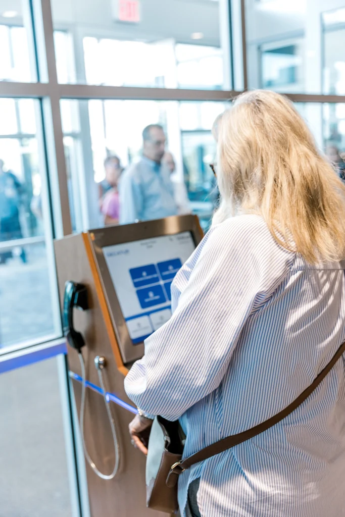 Citizen using smart police station kiosk