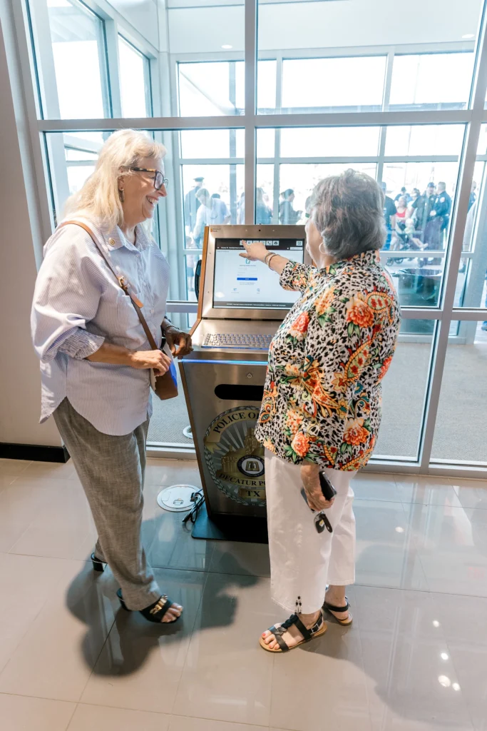 Women using police kiosk