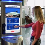 Traveler Uses Airport Kiosk and User Interface